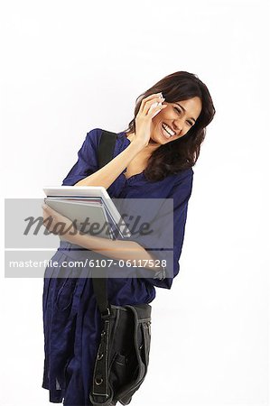 Portrait of a young woman talking on mobile phone