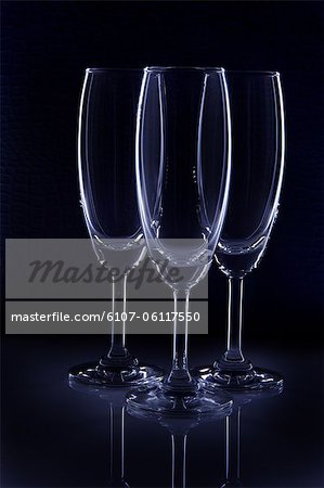 Close-up of three empty wine glasses