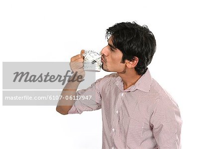 Portrait of man kissing coffee cup