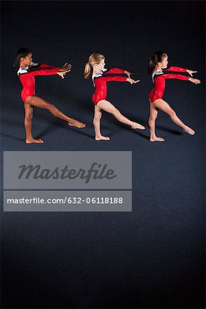 Young girl gymnasts practicing