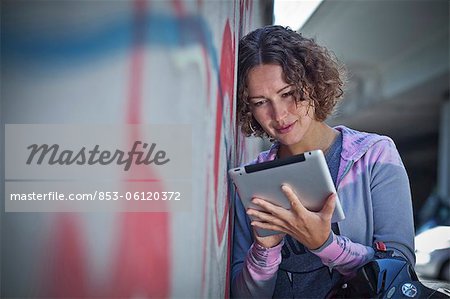 Woman with helmet and ipad