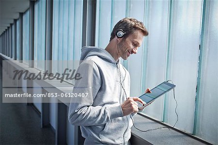 Man with ipad outdoors