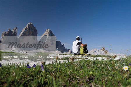 Hiker in front of Tre Cime di Lavaredo, Dolomites, South Tyrol, Italy