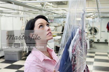 Beautiful woman looking up in laundry