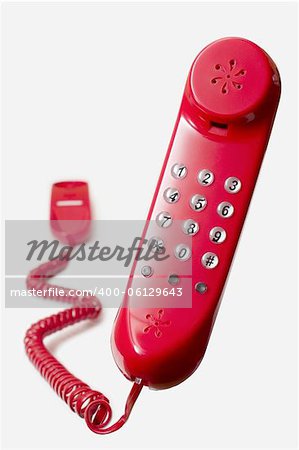 floating red telephone isolated on white background