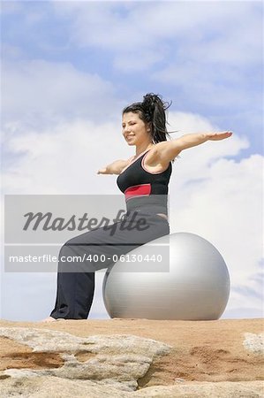 Girl using a pilates ball