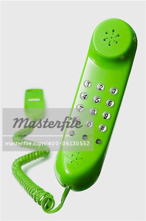 floating green telephone isolated on white background