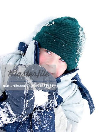 Young boy playing in snow