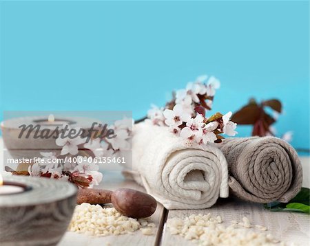 Spa and wellness setting with natural soap, candles and towel. Beige dayspa nature set with copyspace