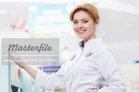 Smiling pharmacist at the pharmacy