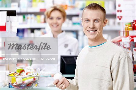 The pharmacist and the customer at the counter
