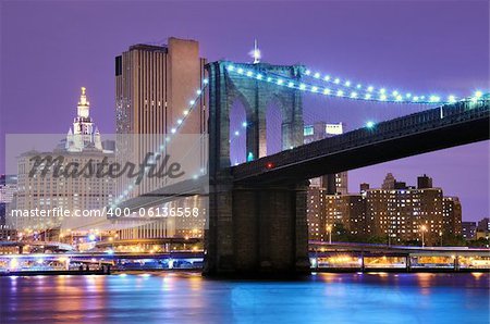 Brooklyn Bridge spans the East River towards Manhattan in New York City