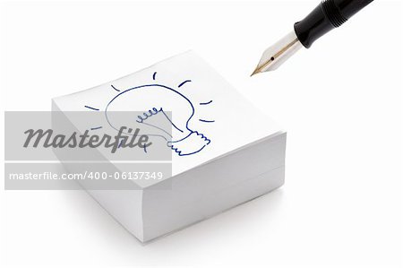 lightbulb drawing on a stack of post it notes illustrating the concept of having an idea
