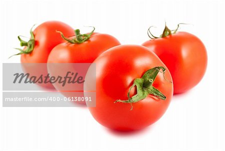 Four red tomatoes isolated on white background