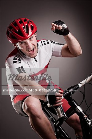 fully equipped cyclist riding a bicycle