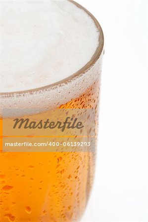 Closeup of Glass of Draught Beer on White Background - Shallow Depth of Field