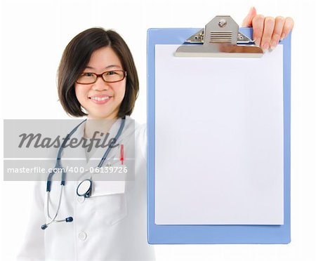Asian female doctor showing blank writing pad on white background