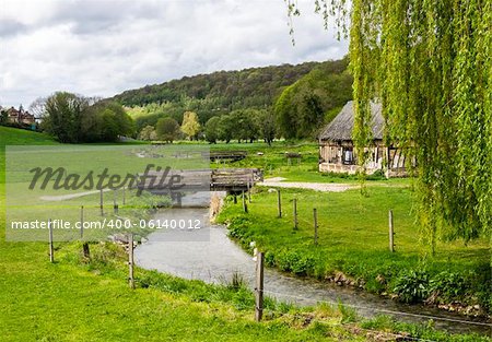 Scenic view on the french spring countryside with river and bridge