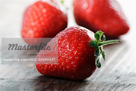 Strawberries on rustick wooden table