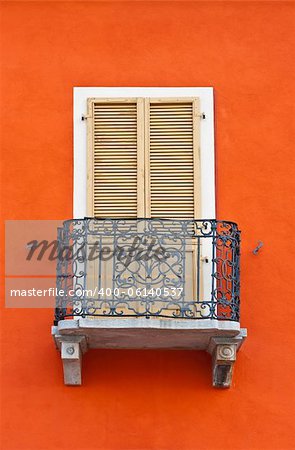 The Renovated Facade of the Old Italian House with Balcony