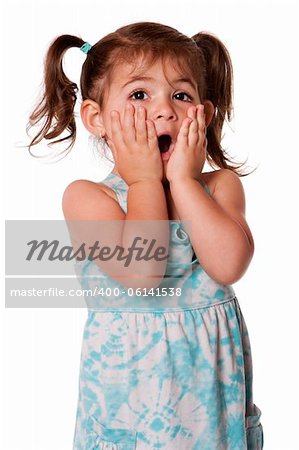 Cute adorable toddler girl surprised innocent expression with hands on cheeks, isolated.