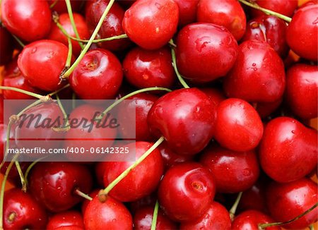 bunch of red red cherry with stem attached