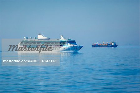 An image of two ships in the blue sea