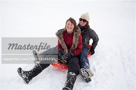 Teenage Girls Tobogganing