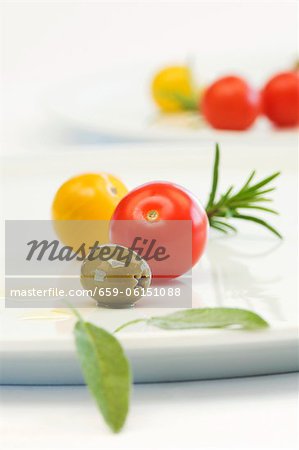 Cherry tomatoes, olives, sage and rosemary