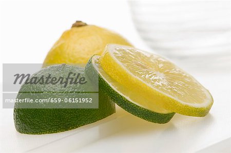 A sliced lemon and a sliced lime