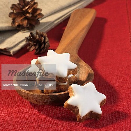 Cinnamon stars on a wooden spoon