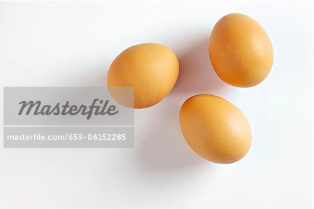 Three brown eggs