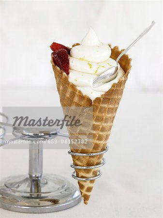 Soft Serve Vanilla Ice Cream in Waffle Cone with Strawberries; In Holder