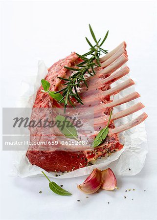 A rack of lamb with fresh herbs