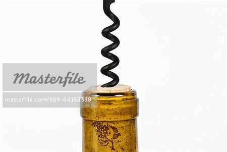 Corkscrew in Wine Bottle; White Background