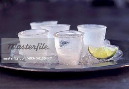 Frozen Vodka Shots on a Tray with Lime Frozen Vodka Shots on a Tray with Lime