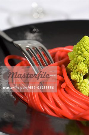 Pink colored spaghetti with Romanesco