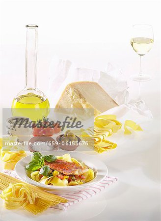 Still life with noodles, olive oil, Parmesan, spices, vegetables and white wine