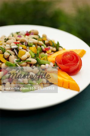 Bowl of White Bean Salad with Papaya Garnish