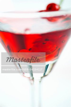 A glass of redcurrant liqueur (close-up)