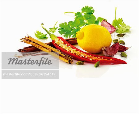 Lemon, chili pepper, garlic, coriander leaves and spices Lemon, chili pepper, garlic, coriander leaves and spices