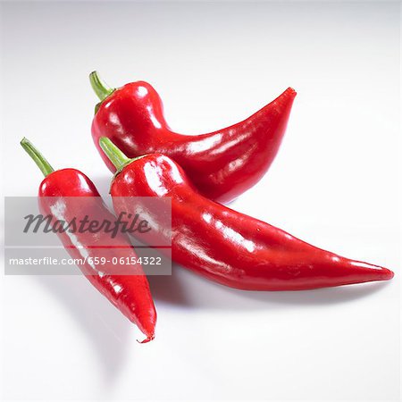 Three red pointed peppers