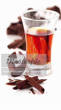 Liqueur in a glass with chocolate curls Liqueur in a glass with chocolate curls