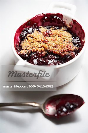 Mixed Berry Crumble in Baking Dish with Spoon