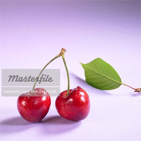 Pair of cherries with drops of water