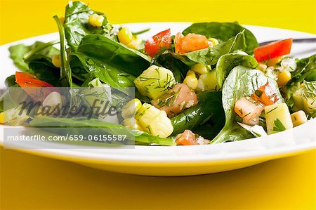 Spinach and sweetcorn salad with tomatoes, cucumber and dill