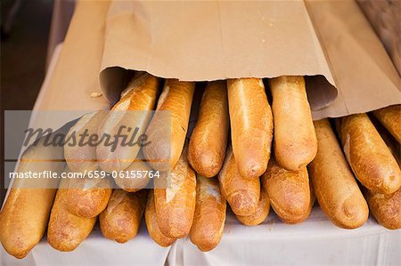 Loaves of French Bread in a Paper Bags at a Market