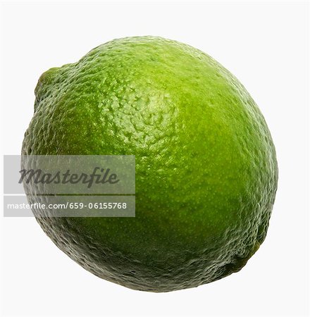 Whole Lime with Water Drops on a Black Background