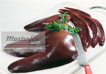 Pig's liver on a chopping board