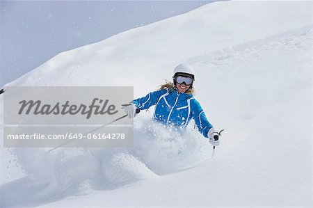 Skier coasting on snowy slope